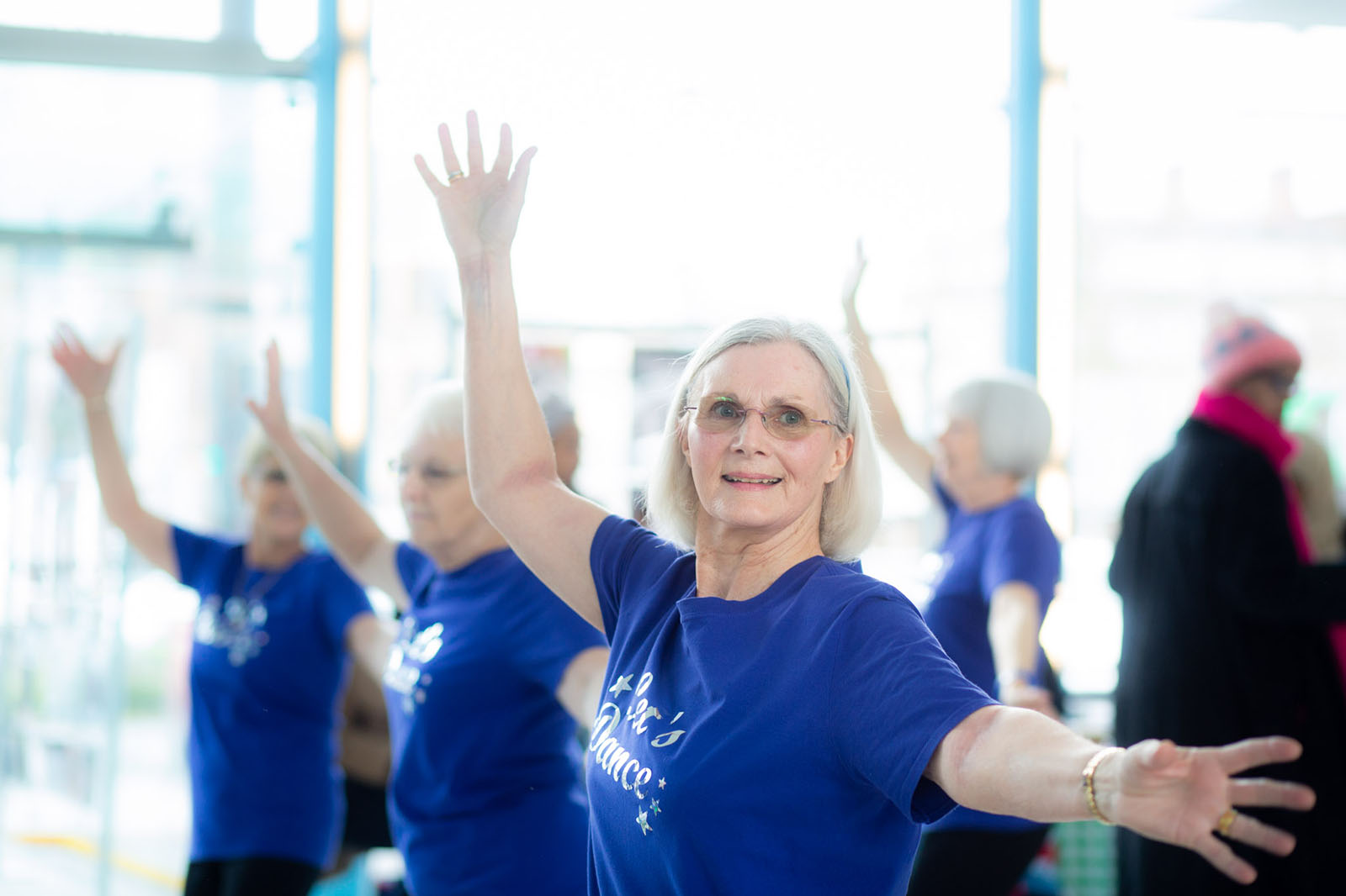 middle aged woman enjoying a dance class